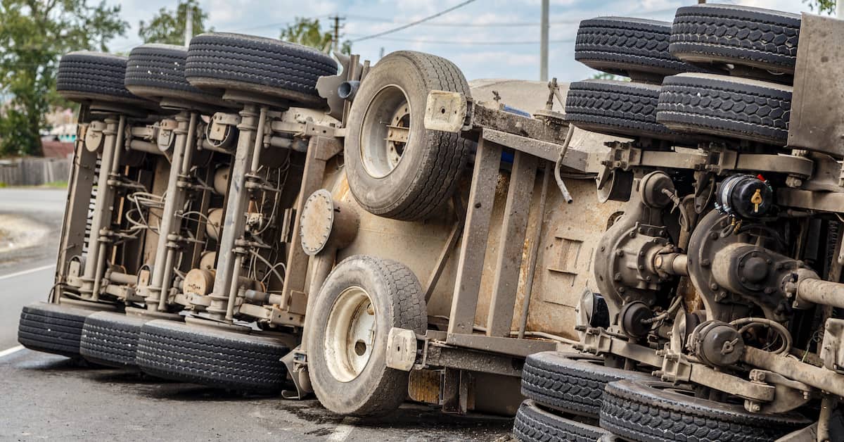 semi-truck rolled over on its side after an accident