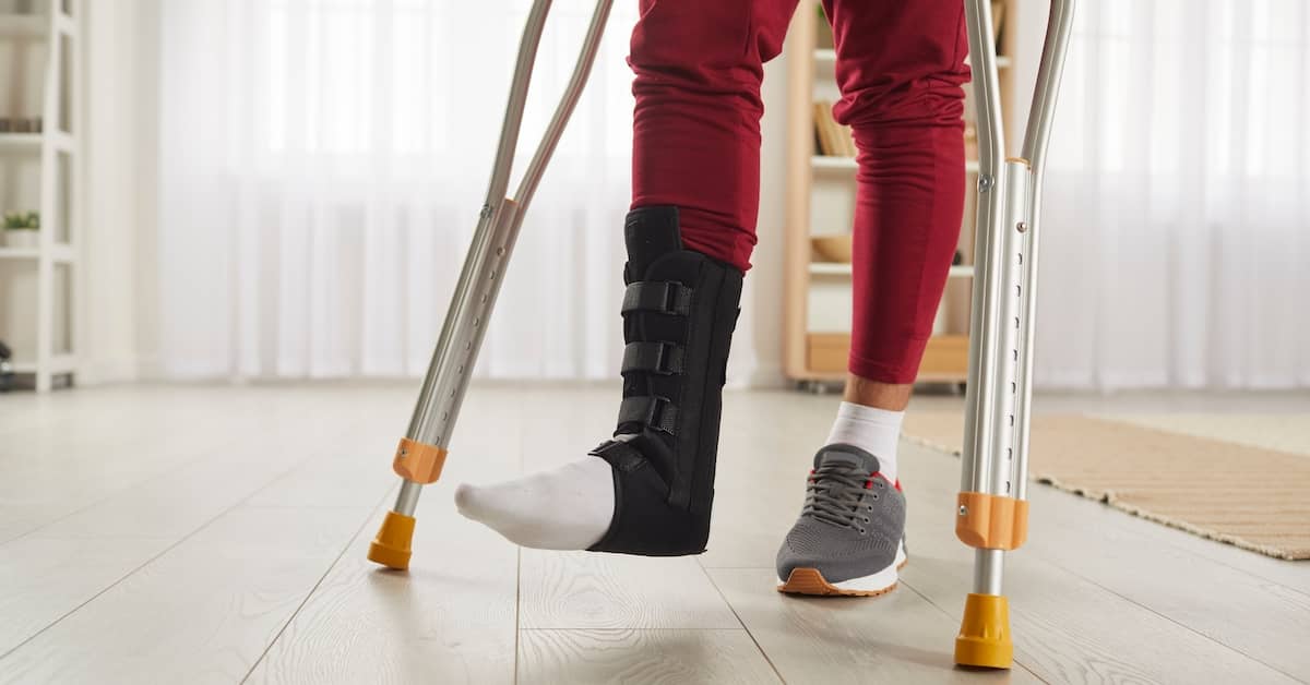 an injury victim walks on crutches | Coplan and Crane